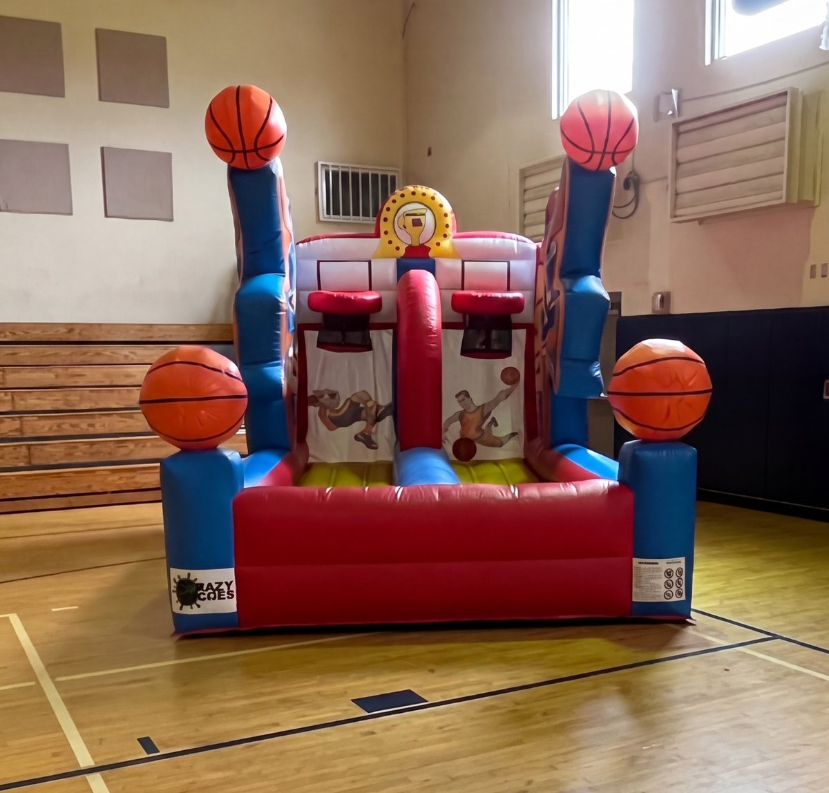 Crazy Games FL Basketball Challenge inflatable game set up on an indoor gym floor