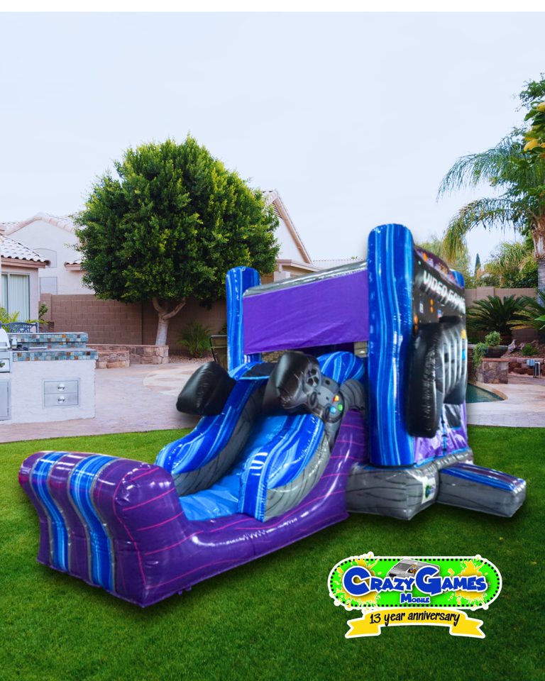 Player One video game bounce house set up on grass