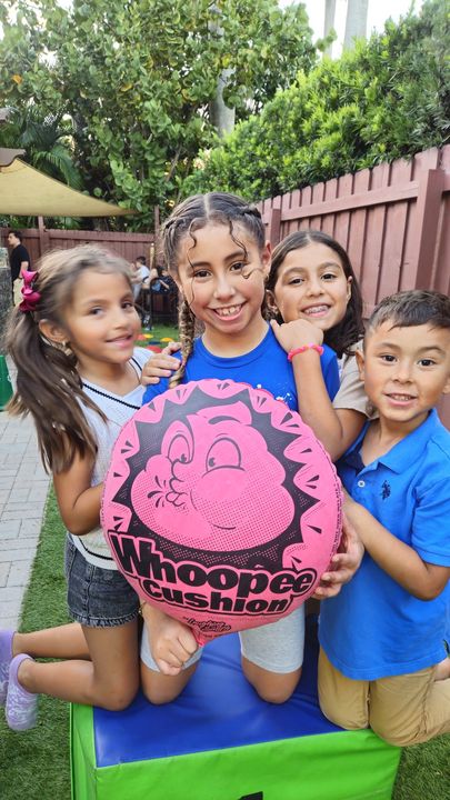 Giant whoopee cushion laughs at a Crazy Games event