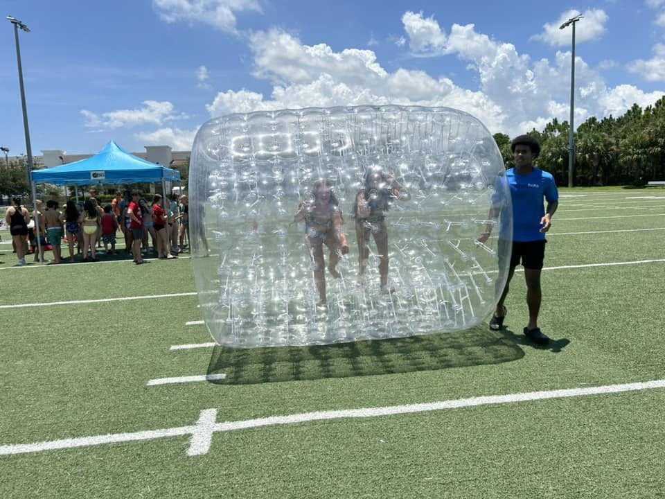 Clear Hamster Wheels at a Crazy Games event