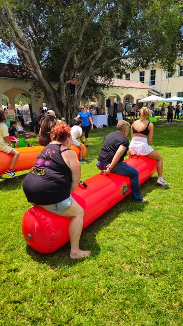 Giant Inflatable Rolling Logs at a Crazy Games event