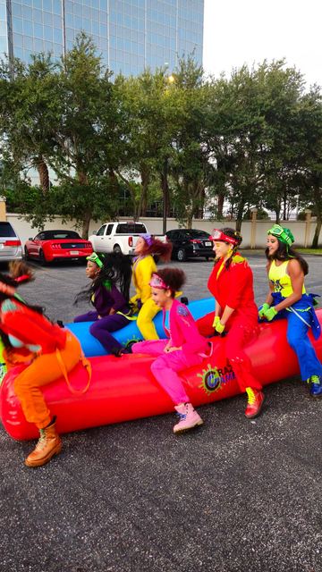 Giant Inflatable Rolling Logs at a Crazy Games event
