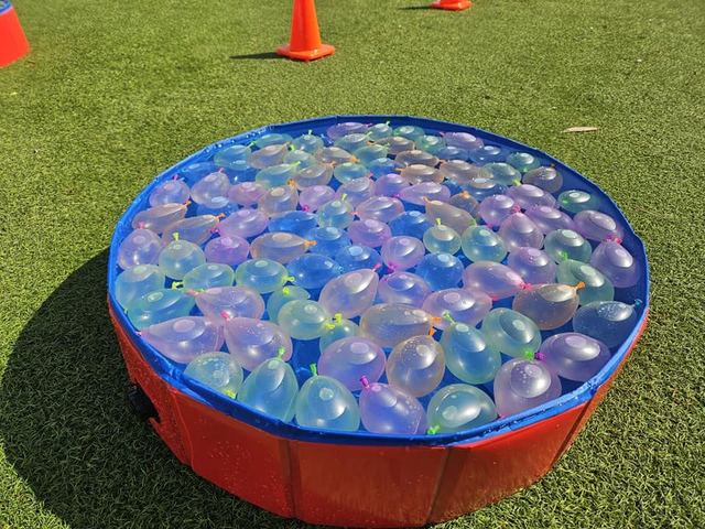 Water Bomb Relay at a Crazy Games event