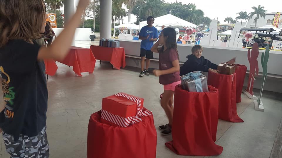 Kids playing Crazy Games holiday games at a real Palm Beach County event