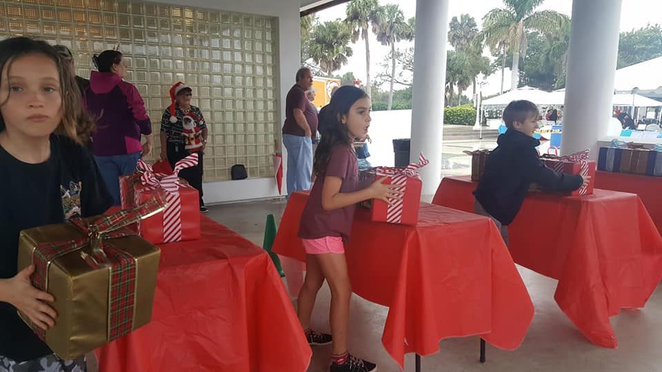 Kids playing Crazy Games holiday games at a real Palm Beach County event