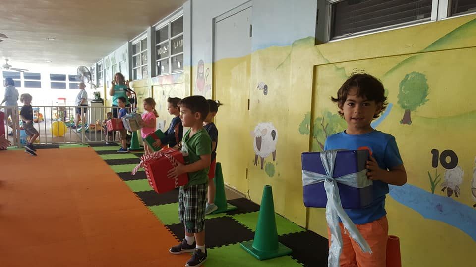 Kids playing Crazy Games holiday games at a real Palm Beach County event