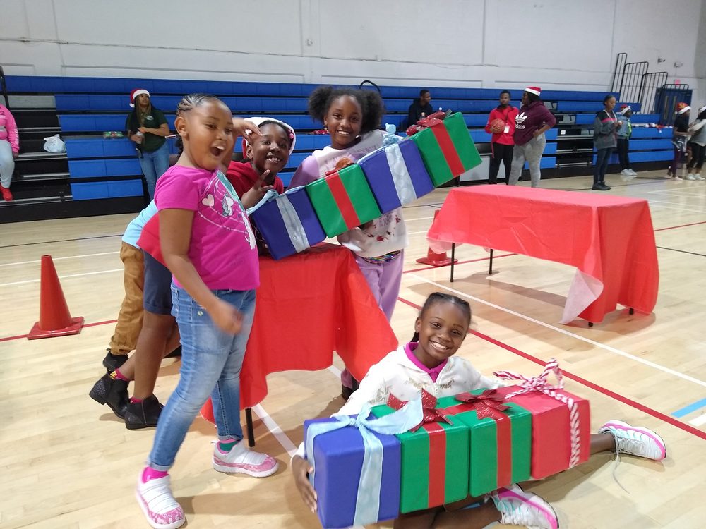 Kids playing Crazy Games holiday games at a real Palm Beach County event