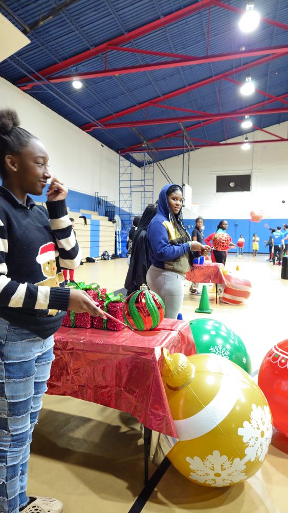 Kids playing Crazy Games holiday games at a real Palm Beach County event