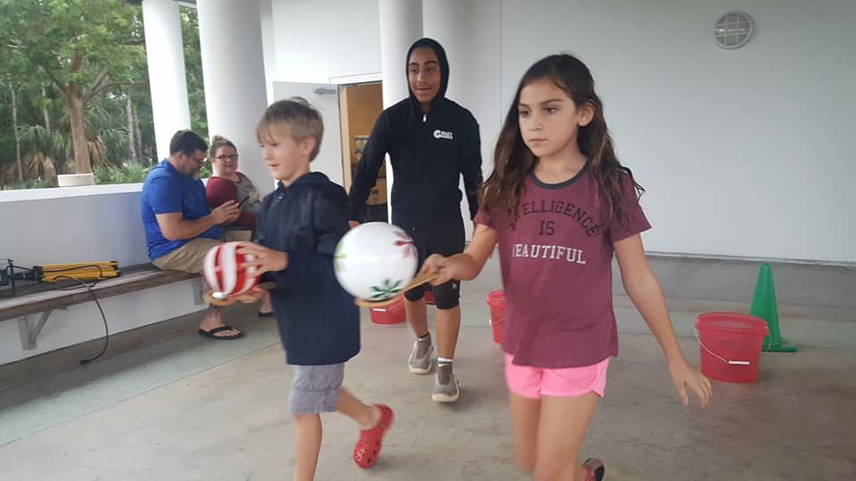 Kids playing Crazy Games holiday games at a real Palm Beach County event