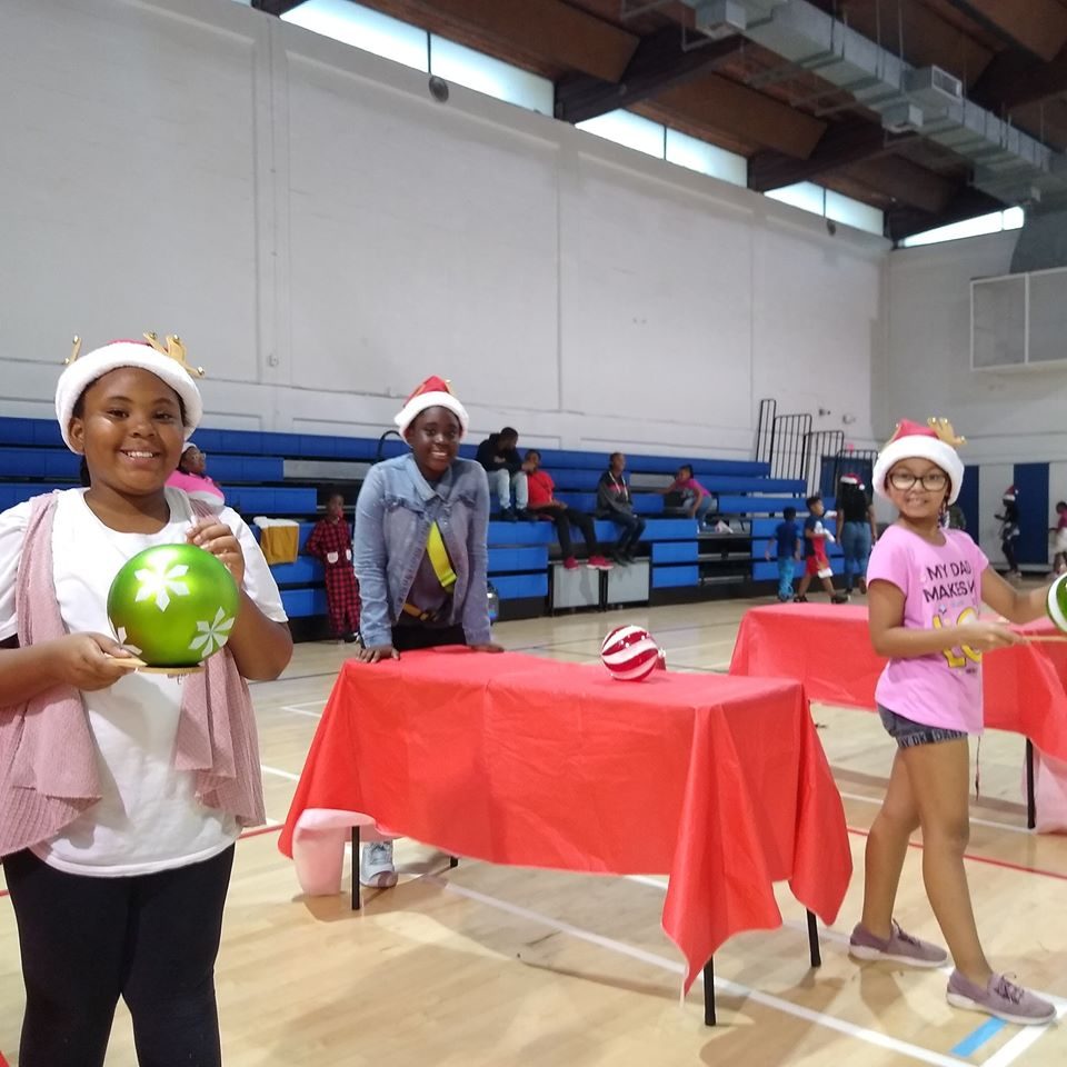 Kids playing Crazy Games holiday games at a real Palm Beach County event