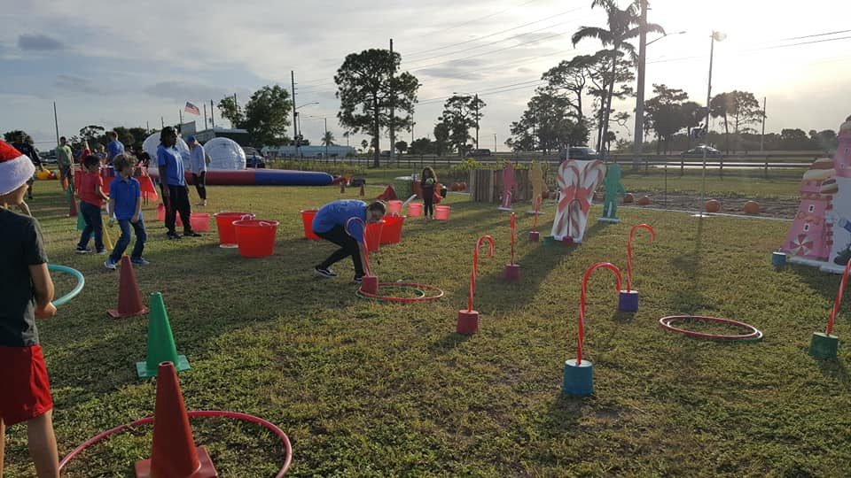 Kids playing Crazy Games holiday games at a real Palm Beach County event