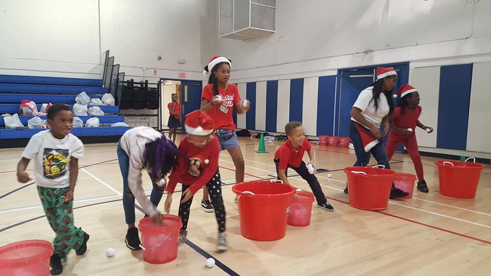 Kids playing Crazy Games holiday games at a real Palm Beach County event