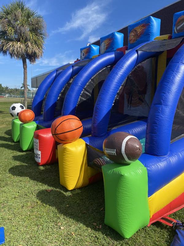 Inflatable sports toss game with soccer ball, basketball and football targets from Crazy Games FL