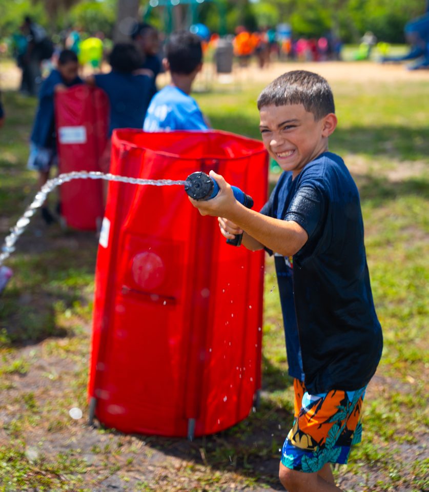 Kids playing Crazy Games interactive games at a real Palm Beach County event