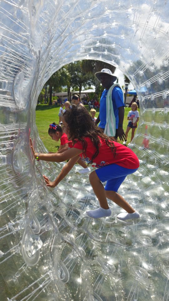 Kids playing Crazy Games interactive games at a real Palm Beach County event