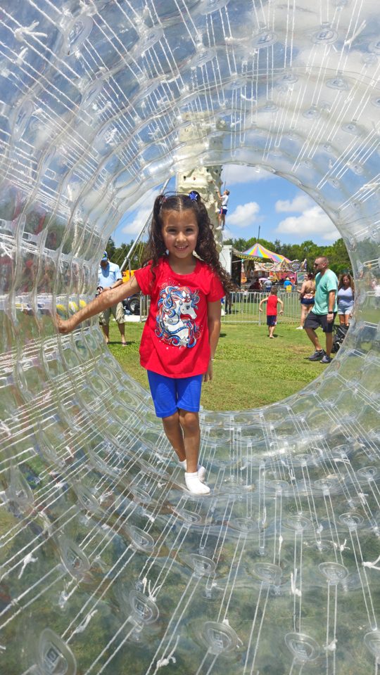 Kids playing Crazy Games interactive games at a real Palm Beach County event