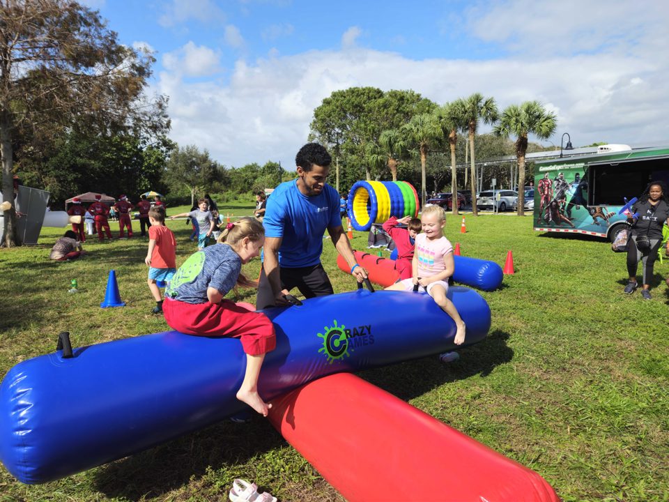 Kids playing Crazy Games interactive games at a real Palm Beach County event