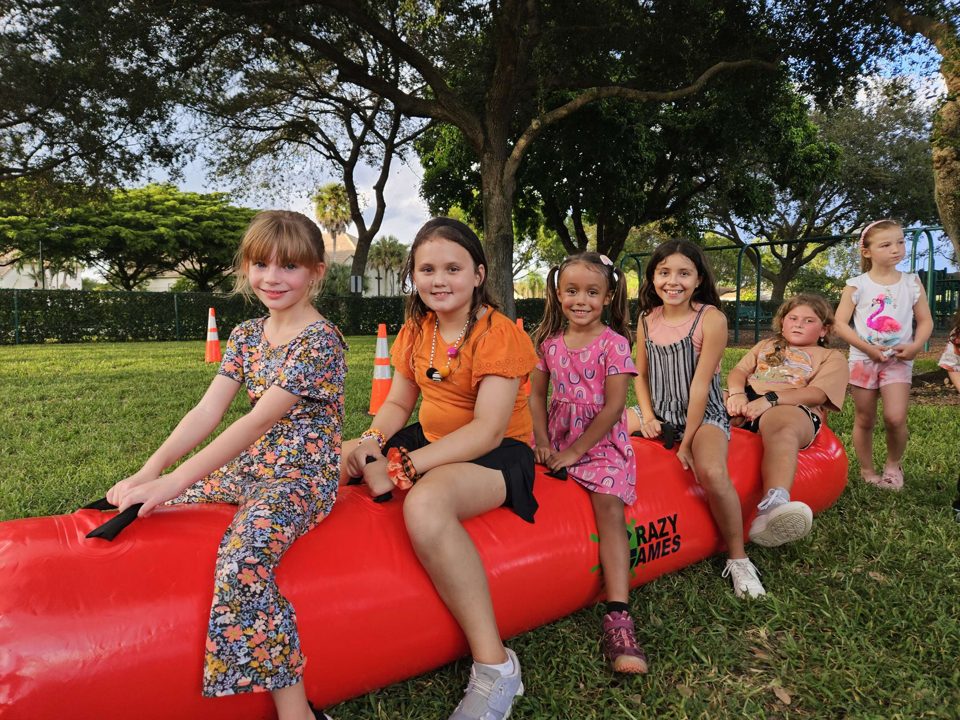 Kids playing Crazy Games interactive games at a real Palm Beach County event
