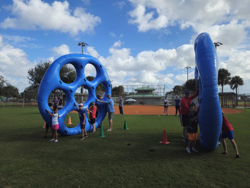 Kids playing Crazy Games interactive games at a real Palm Beach County event