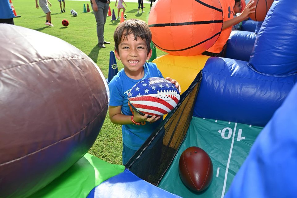 Kids playing Crazy Games interactive games at a real Palm Beach County event